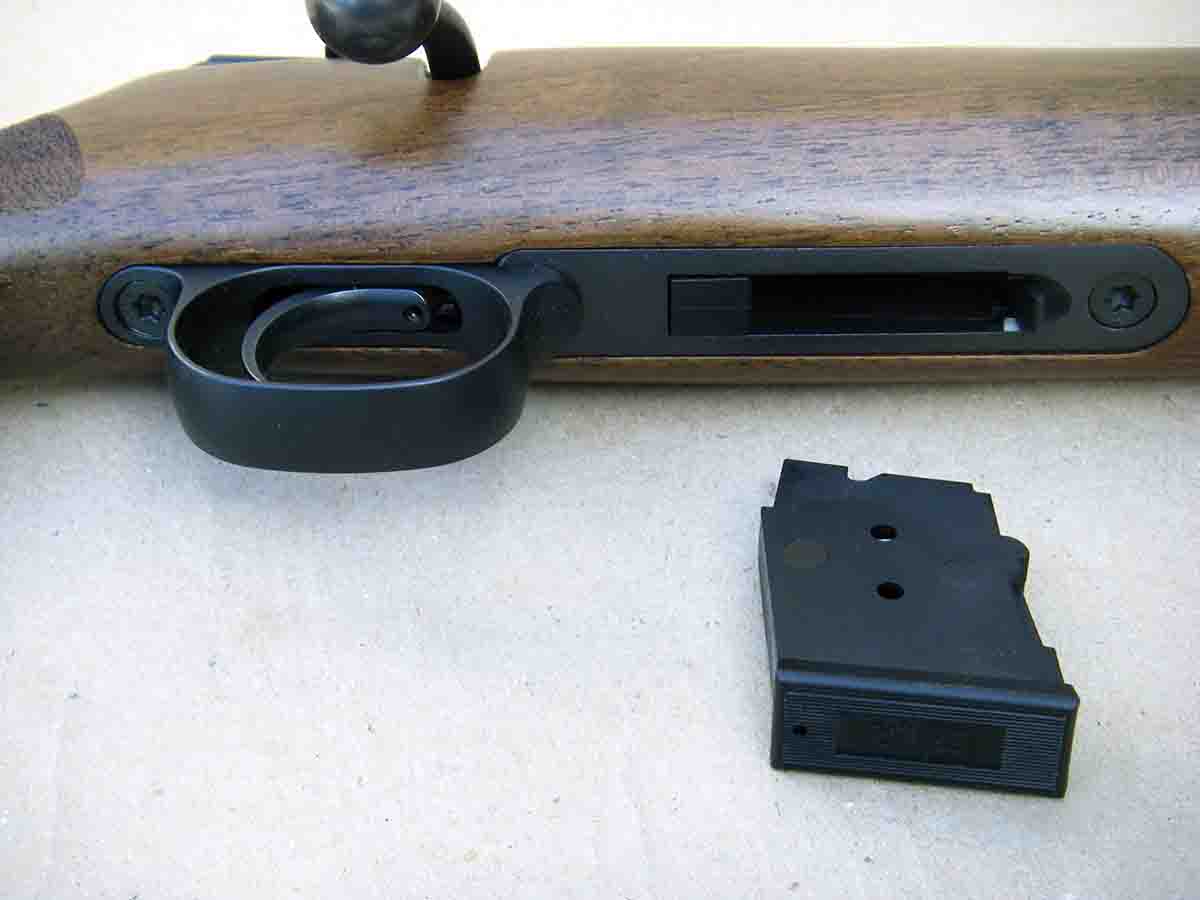 The bottom metal is steel and accommodates a detachable magazine.